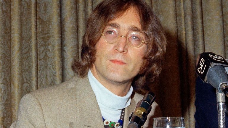 Singer John Lennon appears during a press conference at the...