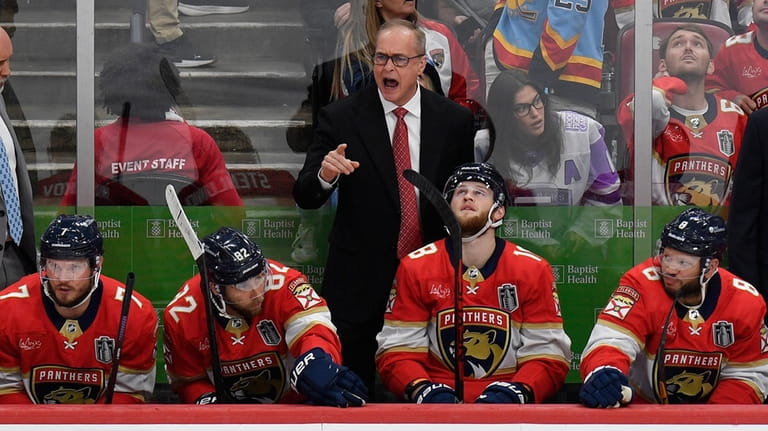 Florida Panthers head coach Paul Maurice. center top, reacts during...