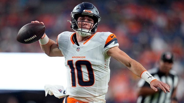 Denver Broncos quarterback Bo Nix passes during the first half...