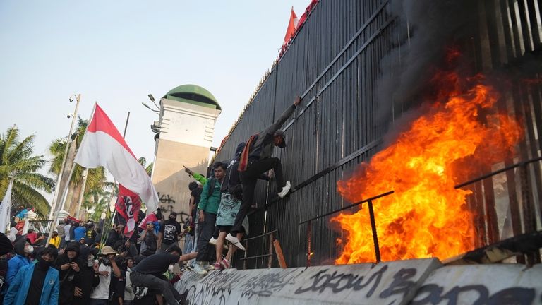 Protesters attempt to storm Indonesia's parliament during a protest against...