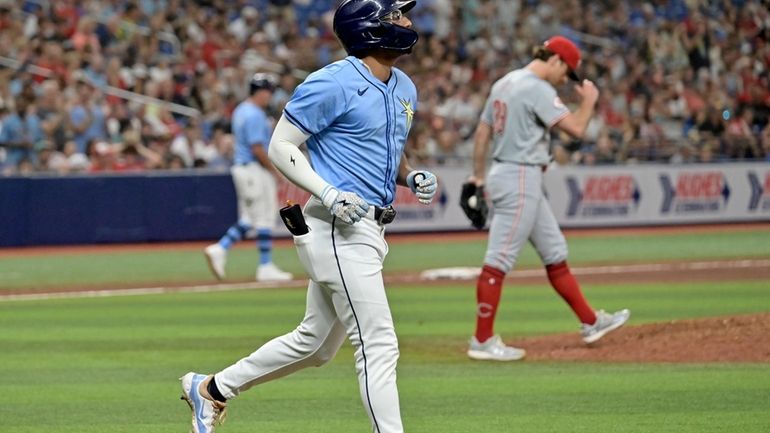 Tampa Bay Rays' Richie Palacios jogs to first base after...