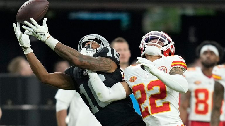 Las Vegas Raiders wide receiver Jakobi Meyers, left, catches a...