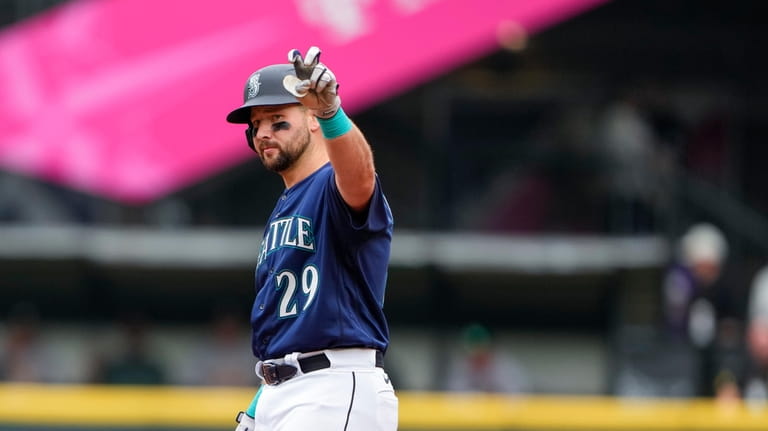 Seattle Mariners designated hitter Cal Raleigh (29) celebrates