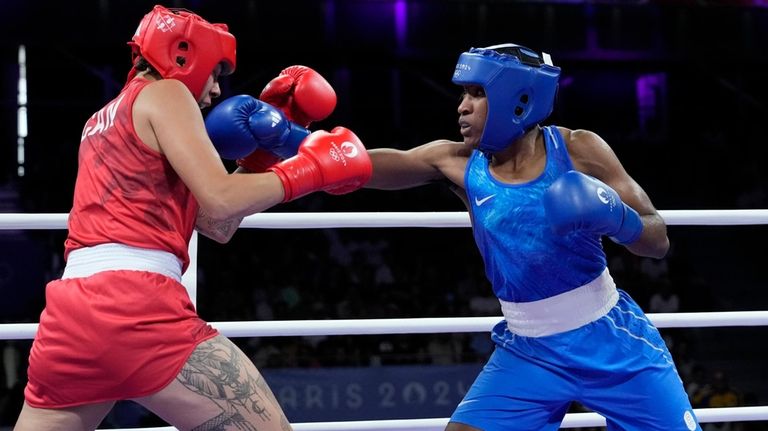 Canada's Tammara Thibeault, left, fights Refugee Olympic Team's Cindy Djankeu...