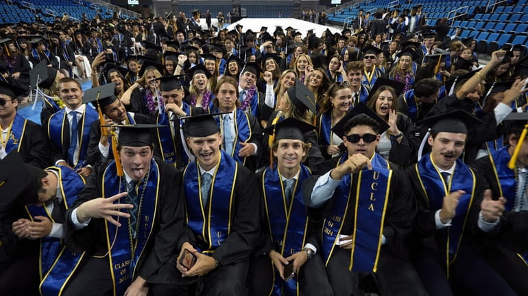 UCLA graduates from the class of 2024 pose for a...