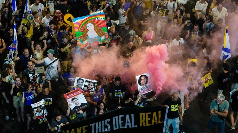 In this aerial image, people attend a rally demanding a...