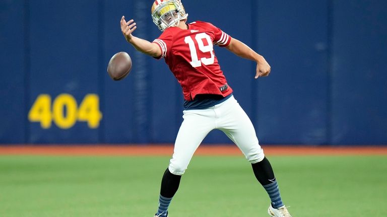 Tampa Bay Rays relief pitcher Robert Stephenson wears a San...