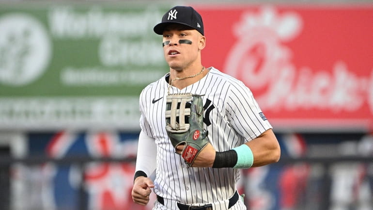 Yankees centerfiielder Aaron Judge runs in from the outfield during...