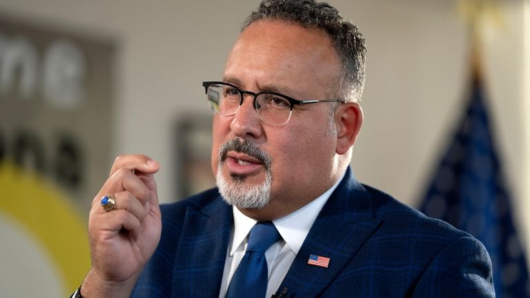 Education Secretary Miguel Cardona speaks during an interview with The...