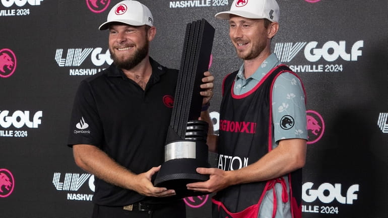First-place individual champion Tyrrell Hatton, left, of Legion XIII, and...