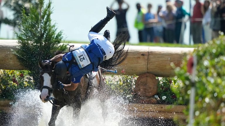 Ecuador's Ronald Zabala G., riding, Forever Young Wundermaske, fall off...