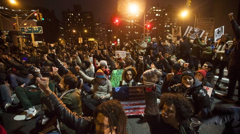 People block an exit from the Lincoln Tunnel during a...
