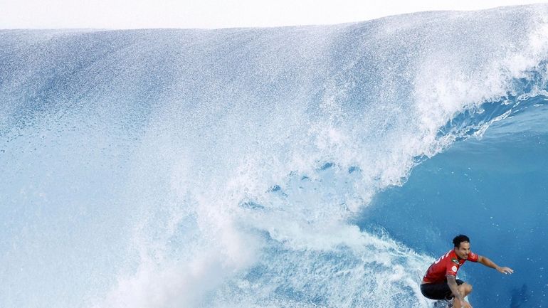 Surfer Italo Ferreira of Brazil competes on his way to...