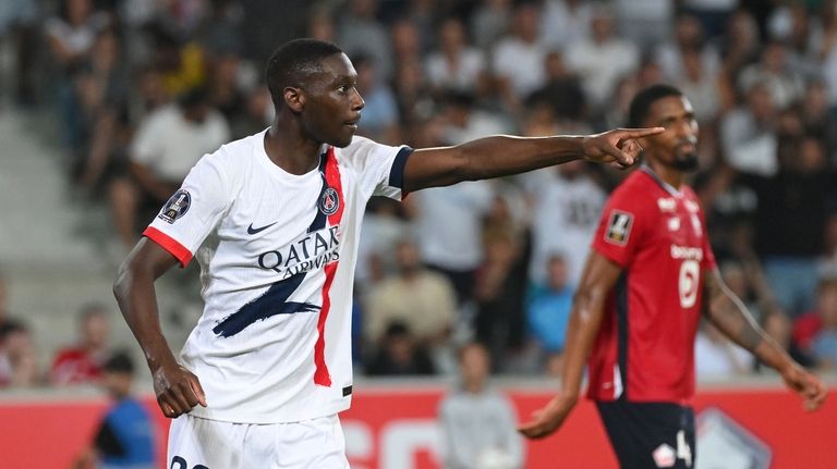 PSG's Randal Kolo Muani celebrates after scoring his side's third...