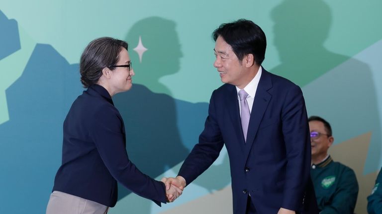 Taiwan Vice President William Lai, right, the candidate for presidential...