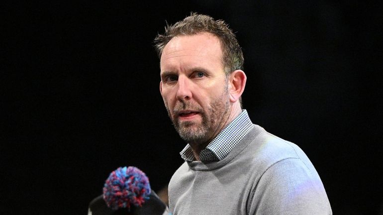 Nets general manager Sean Marks looks on before a game...