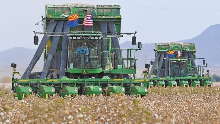 Two John Deere on board module cotton strippers, owned and...