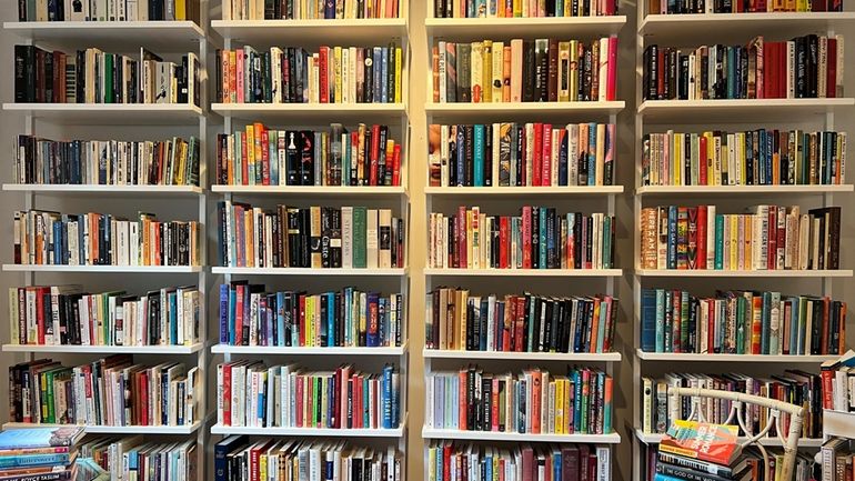 Part of Manhasset High School librarian Karin Greenberg’s home library, in...