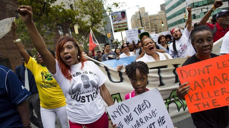 Mother of Ramarley Graham, Constance Malcolm, left, and family friend...