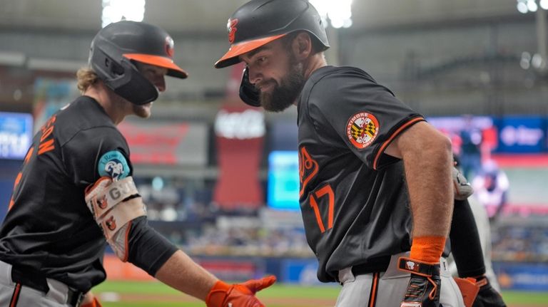 Baltimore Orioles' Colton Cowser (17) celebrates his solo home run...