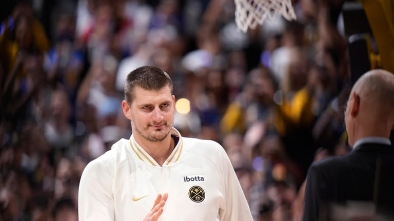 Jokic and the Nuggets receive rings, watch championship banner raised  before tipping off season - The San Diego Union-Tribune