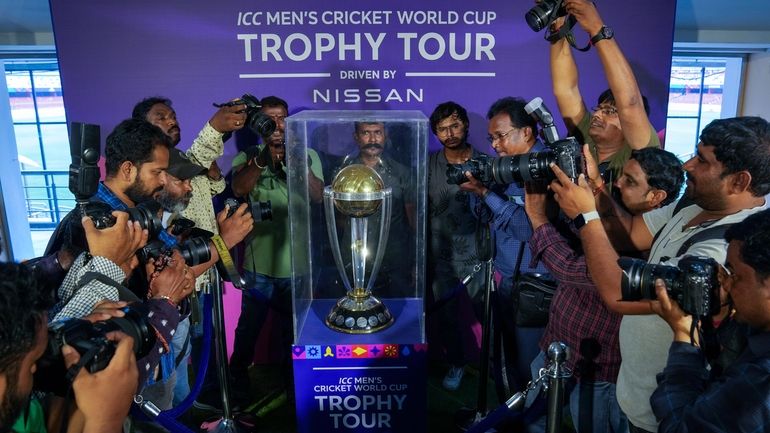 Photographers take pictures during a trophy tour of the upcoming...