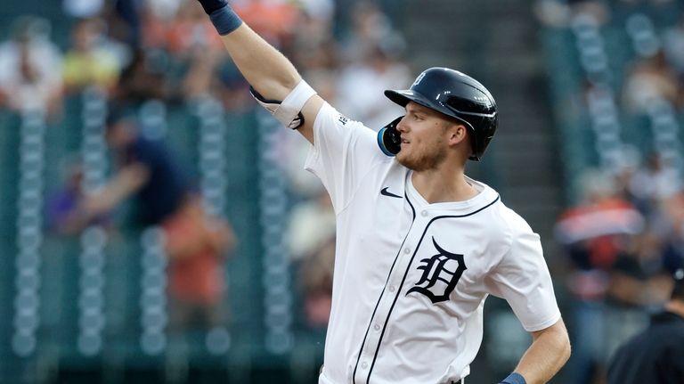 Detroit Tigers' Parker Meadows rounds the bases after hitting a...