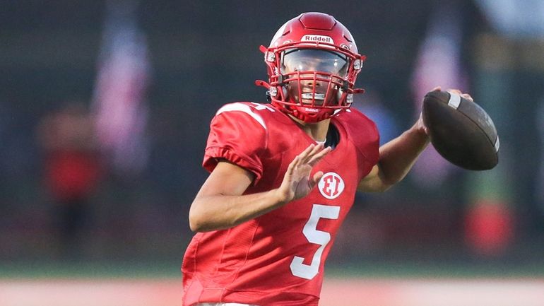 East Islip's Thomas Costarelli (5) throws a pass in the...