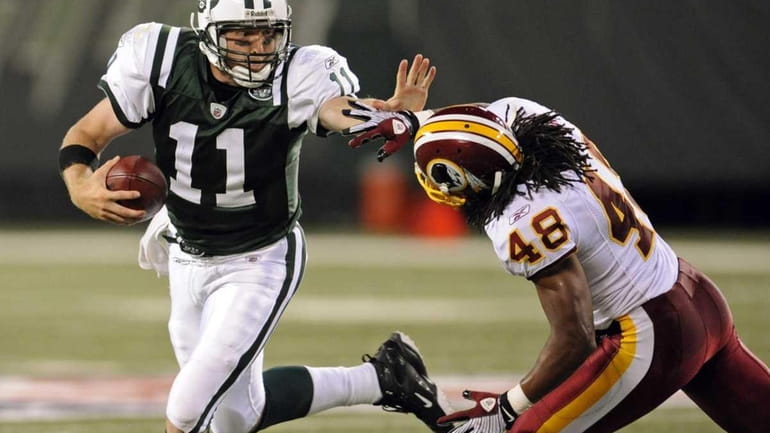 Jets quarterback Kellen Clemens (11) scrambles away from Washington Redskins...
