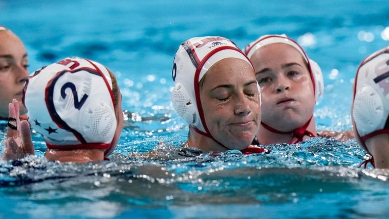 United States' players react after loosing the women's bronze medal...