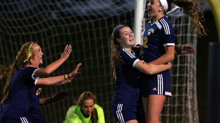 Massapequa's Melanie Hingher celebrates her first goal against West Islip...