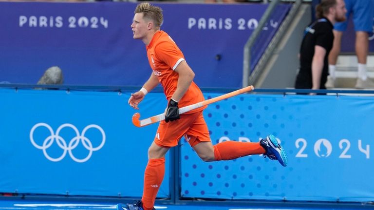 Netherlands Koen Bijen celebrates after scoring his side's first goal...