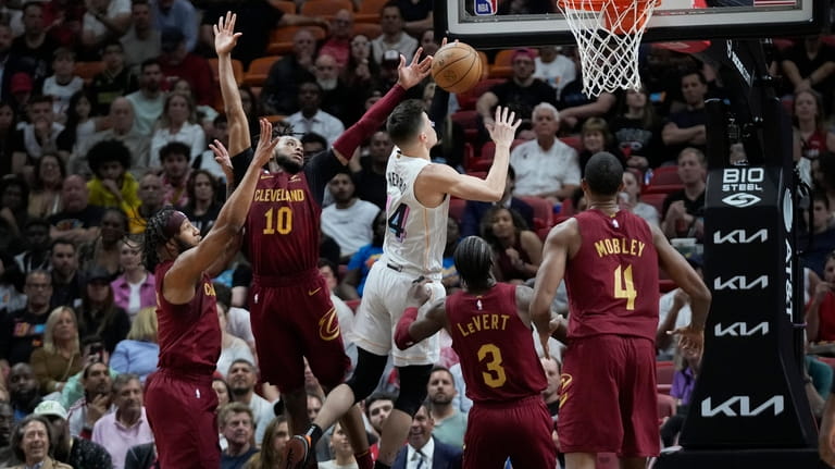 Miami Heat guard Tyler Herro (14) goes up for a...