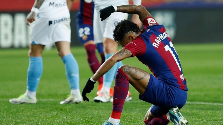 Barcelona's Raphinha reacts during the Spanish La Liga soccer match...