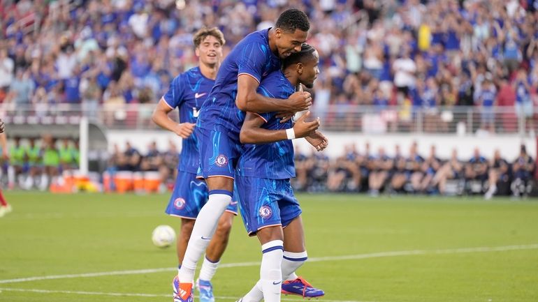 Chelsea forward Christopher Nkunku, center, celebrates with Chelsea defender Levi...