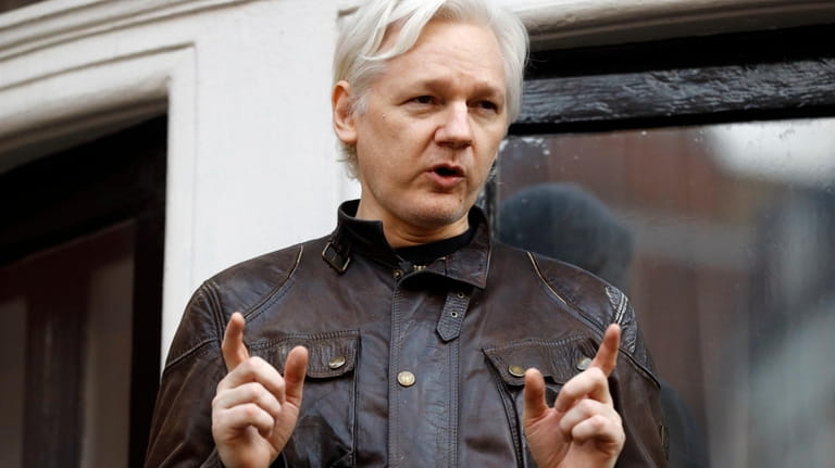 Julian Assange speaks to the media outside the Ecuadorian embassy...