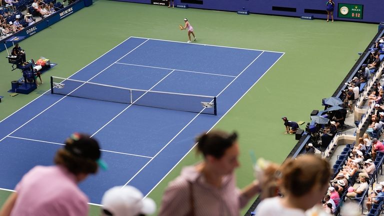 Spectators move to their seats during play between Varvara Gracheva,...