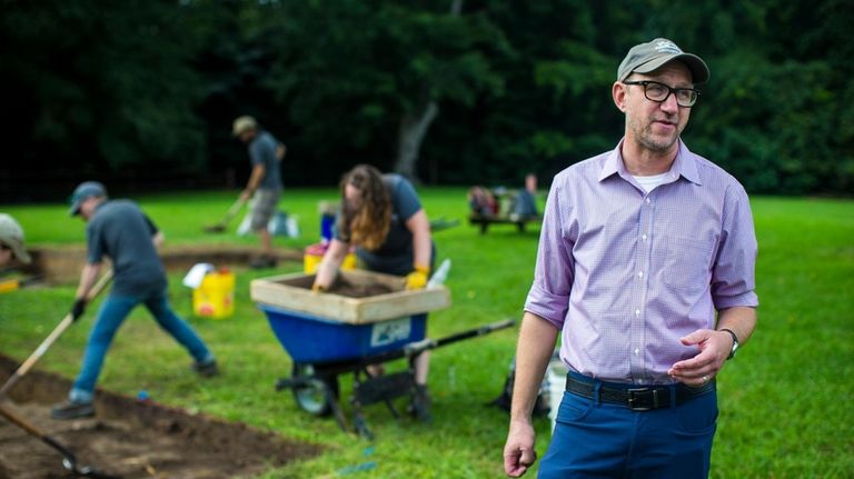 Jack Gary, Colonial Williamsburg’s executive director of archaeology, speaks at...