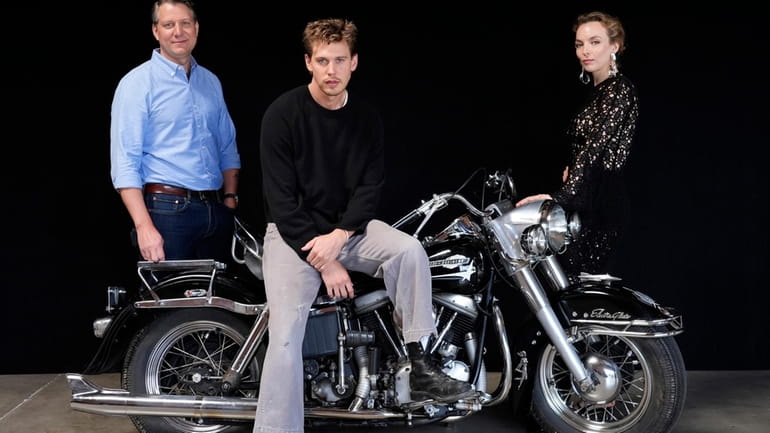 Jeff Nichols, left, writer/director of "The Bikeriders," poses with cast...