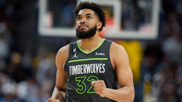 Minnesota Timberwolves center Karl-Anthony Towns looks on in the second...