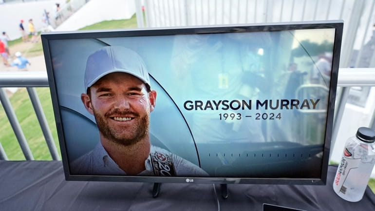 A golf television broadcast is played at the broadcast tent...