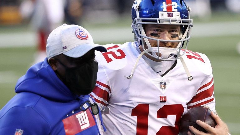 Colt McCoy of the Giants celebrates after defeating the Seahawks at Lumen...