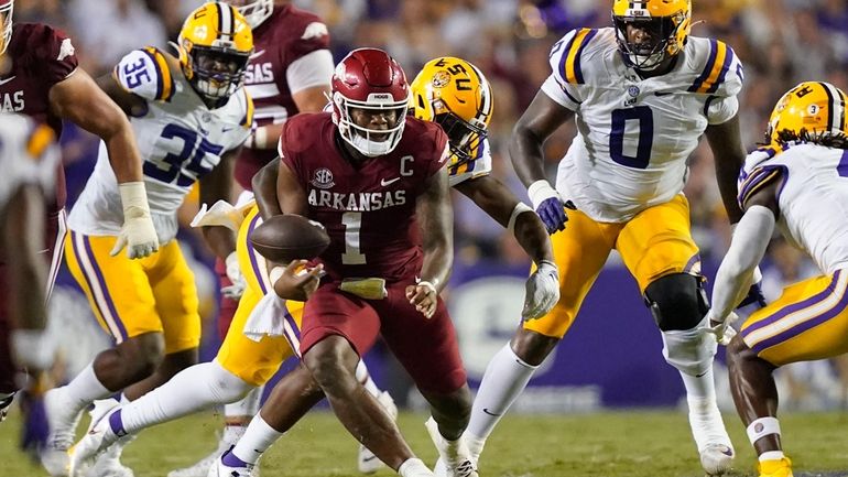 Arkansas quarterback KJ Jefferson (1) fumbles in the second half...