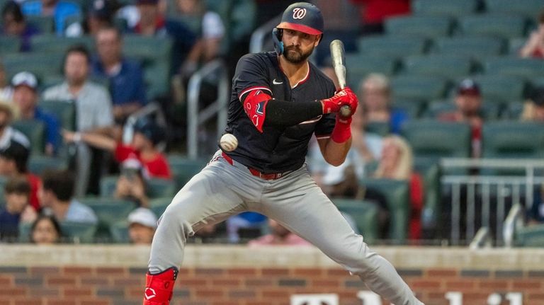 Washington Nationals' Joey Gallo watches a pitch go by called...