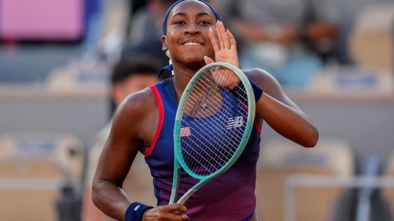 Coco Gauff of United States celebrates her victory over Ajla...