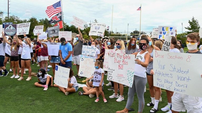 Parents and students rally in Massapequa on Aug. 31 for...