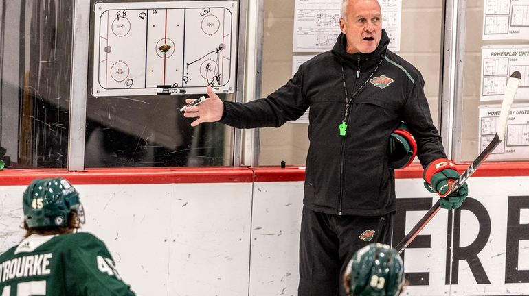 Minnesota Wild head coach Dean Evason speaks to players during...