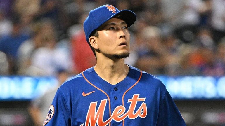 Mets starting pitcher Kodai Senga walks to the dugout against...