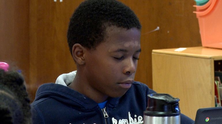 Malachi Smith meditates during a mindfulness session in his classroom...