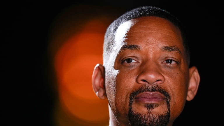 Actor Will Smith poses during a photo shoot to promote...